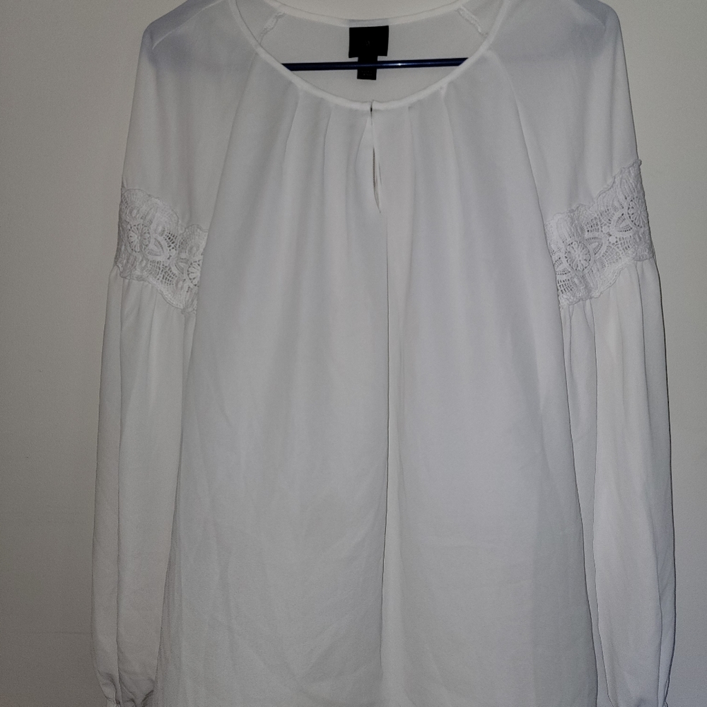 Semi-sheer white blouse with lace detailing